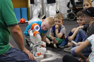 Children looking at robot