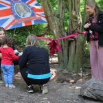 Children adding items to time capsule